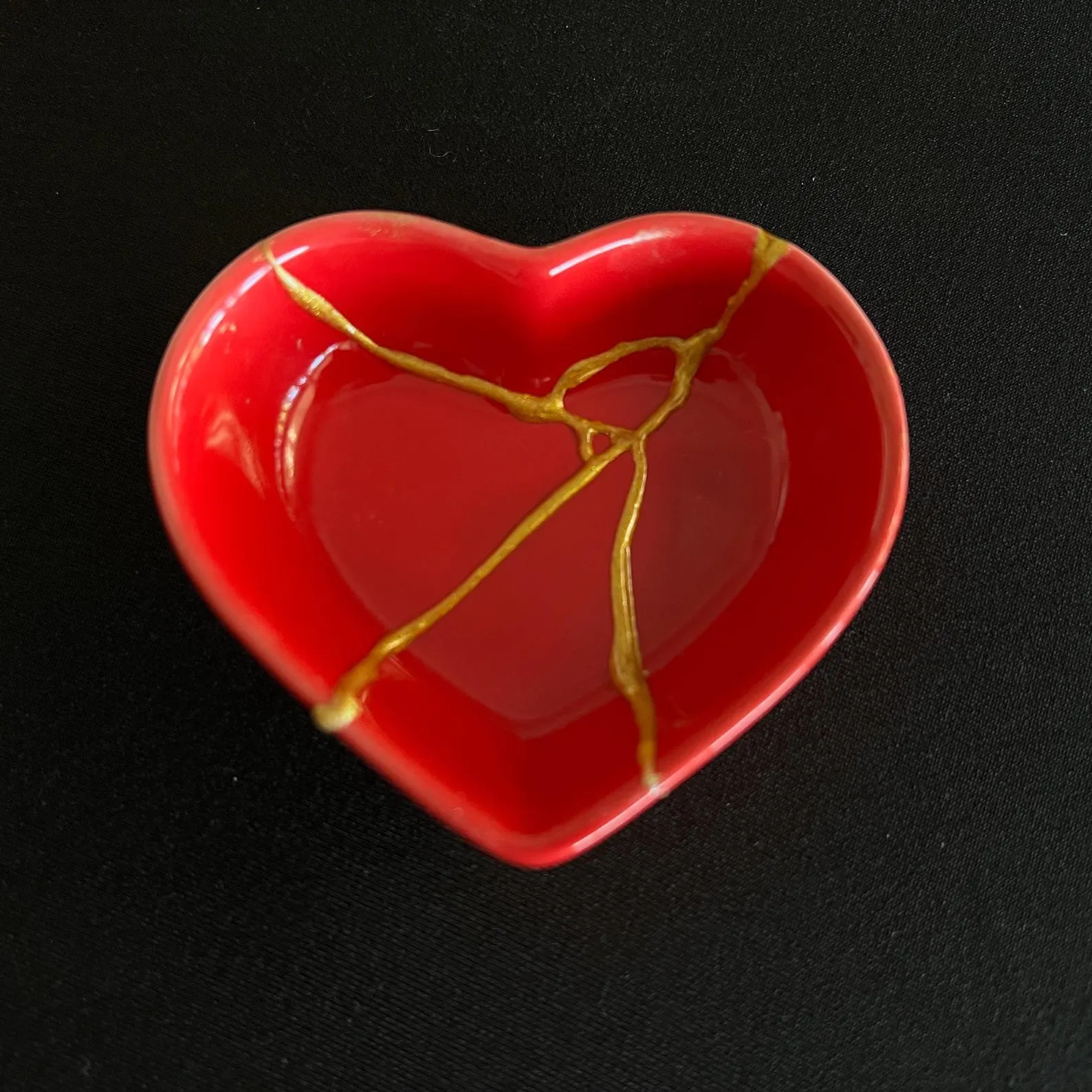 Heart with gold-filled scars